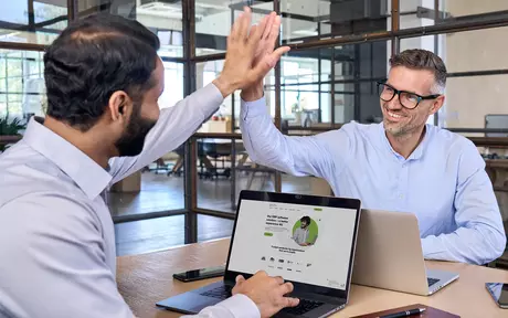 men celebrating in a meeting